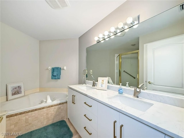 15054 Tamarind Cay Ct Unit 706, Fort Myers, FL 33908 - bathroom featuring double vanity, a bath, and a stall shower