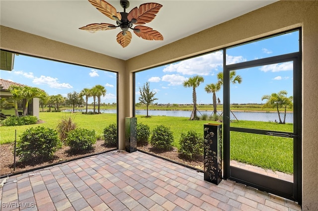 6334 Achievement Ave, Ave Maria, FL 34142 - unfurnished sunroom with a water view and ceiling fan