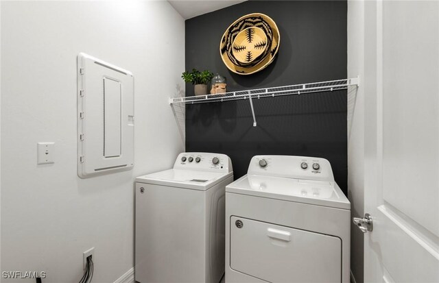 3740 Passion Vine Dr, Alva, FL 33920 - washroom featuring electric panel and washing machine and clothes dryer