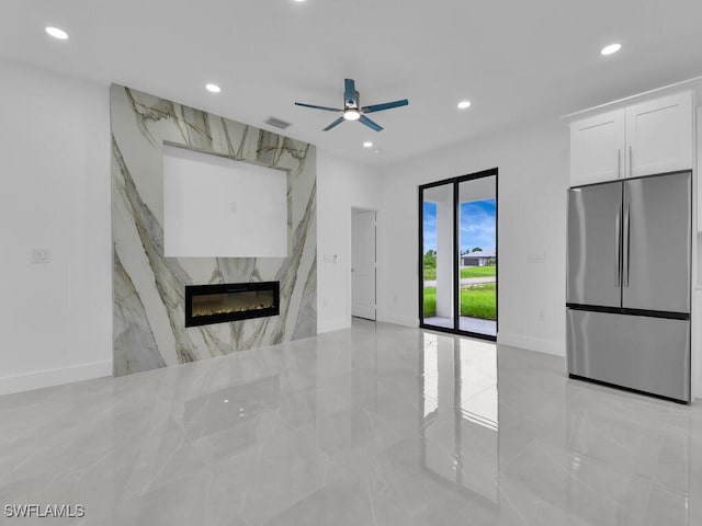 3301 8th St SW, Lehigh Acres, FL 33976 - unfurnished living room featuring recessed lighting, a ceiling fan, baseboards, a fireplace, and light marble finish floors