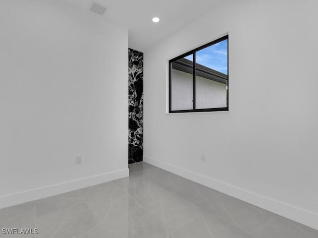 3301 8th St SW, Lehigh Acres, FL 33976 - empty room featuring baseboards and recessed lighting
