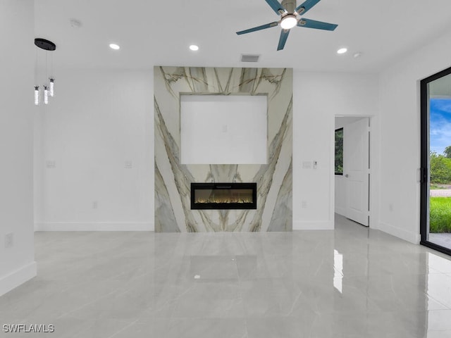 3301 8th St SW, Lehigh Acres, FL 33976 - unfurnished living room with marble tiled floors, baseboards, recessed lighting, a fireplace, and ceiling fan