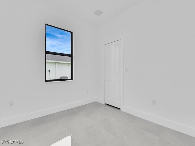 3301 8th St SW, Lehigh Acres, FL 33976 - spare room with baseboards