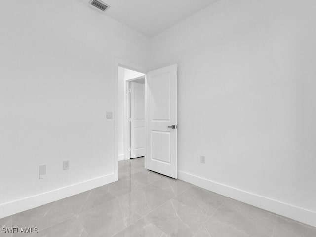 3301 8th St SW, Lehigh Acres, FL 33976 - spare room with baseboards