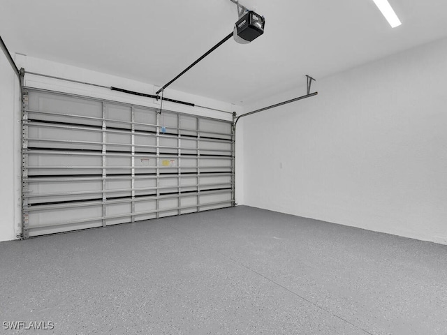 3301 8th St SW, Lehigh Acres, FL 33976 - garage featuring a garage door opener