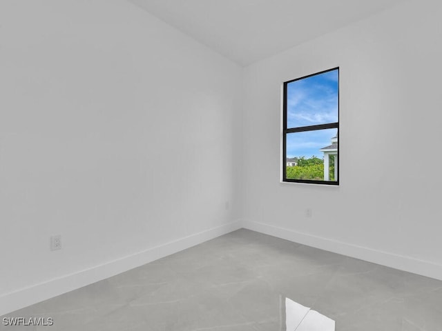 3301 8th St SW, Lehigh Acres, FL 33976 - spare room featuring baseboards