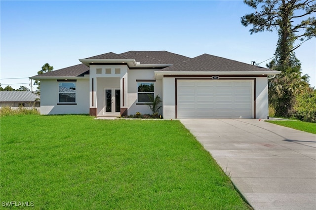 908 Barcia St E, Lehigh Acres, FL 33974 - prairie-style house featuring stucco siding, a front yard, concrete driveway, a garage, and french doors