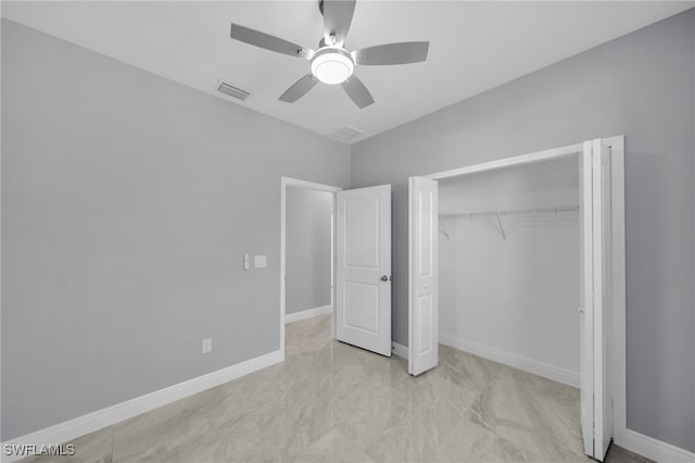 908 Barcia St E, Lehigh Acres, FL 33974 - unfurnished bedroom with a closet, ceiling fan, and baseboards