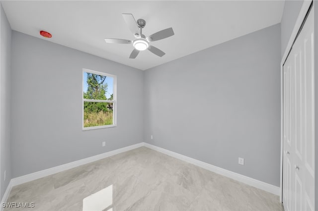 908 Barcia St E, Lehigh Acres, FL 33974 - unfurnished room featuring a ceiling fan and baseboards