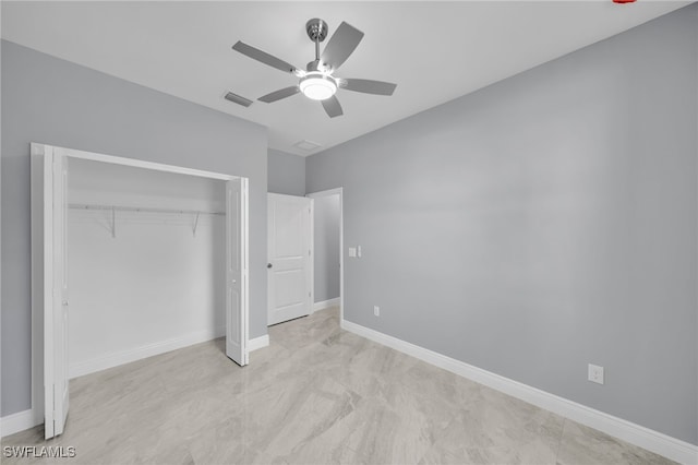 908 Barcia St E, Lehigh Acres, FL 33974 - unfurnished bedroom with a closet, baseboards, and ceiling fan