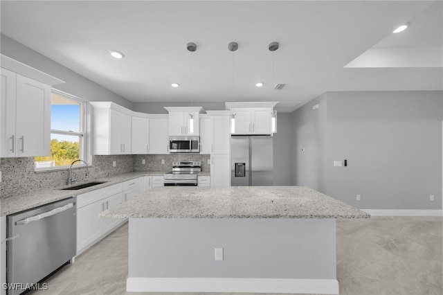 908 Barcia St E, Lehigh Acres, FL 33974 - kitchen featuring stainless steel appliances, a sink, decorative backsplash, white cabinetry, and recessed lighting