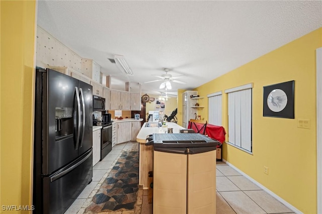 919 Manatee Rd, Naples, FL 34114 - kitchen featuring black appliances, ceiling fan, a kitchen island, light brown cabinetry, and light tile patterned flooring
