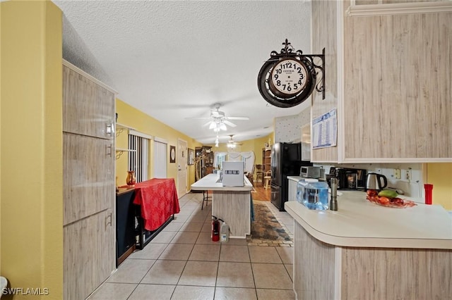 919 Manatee Rd, Naples, FL 34114 - kitchen with light brown cabinets, light tile patterned floors, ceiling fan, light countertops, and modern cabinets