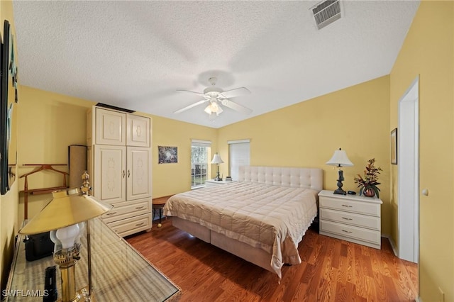 919 Manatee Rd, Naples, FL 34114 - bedroom featuring wood finished floors, a textured ceiling, and a ceiling fan