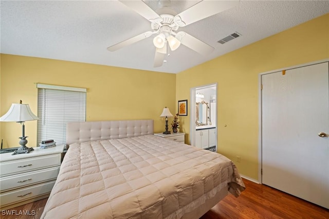 919 Manatee Rd, Naples, FL 34114 - bedroom featuring wood finished floors, ensuite bathroom, and a ceiling fan