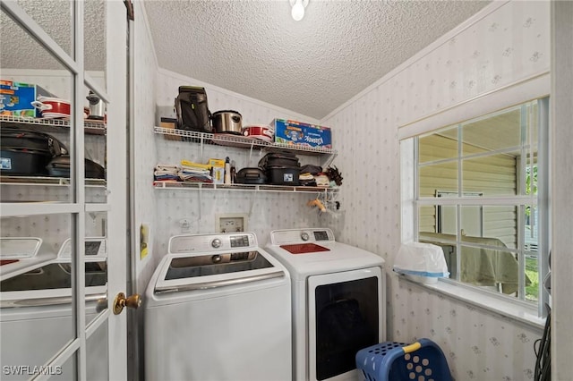 919 Manatee Rd, Naples, FL 34114 - laundry area featuring a textured ceiling, separate washer and dryer, wallpapered walls, and ornamental molding
