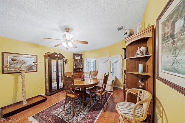 919 Manatee Rd, Naples, FL 34114 - dining space with a textured ceiling, light wood-style flooring, and ceiling fan