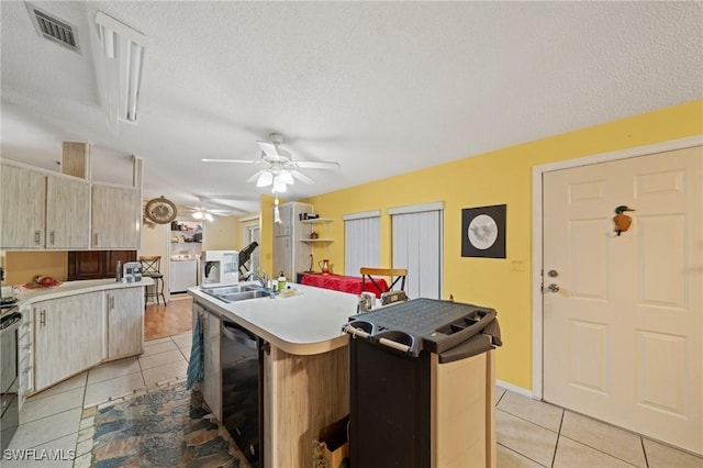 919 Manatee Rd, Naples, FL 34114 - kitchen with light tile patterned flooring, dishwasher, a kitchen island with sink, ceiling fan, and a textured ceiling