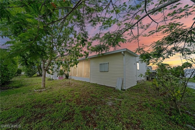 919 Manatee Rd, Naples, FL 34114 - property exterior at dusk with a lawn