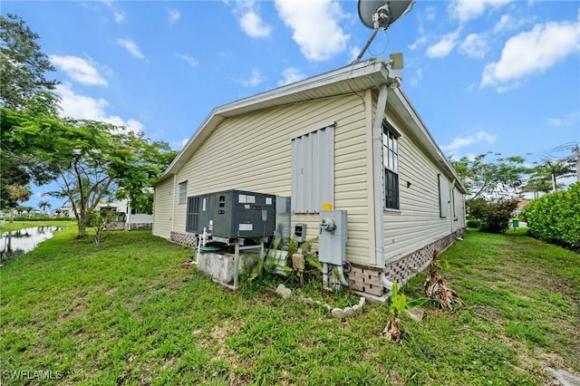 919 Manatee Rd, Naples, FL 34114 - rear view of house featuring a yard and a water view