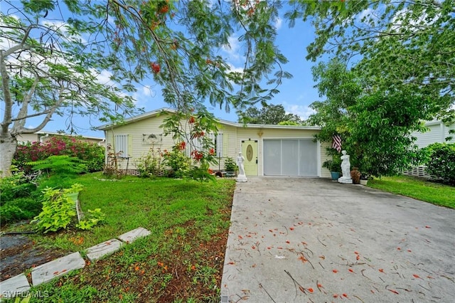 919 Manatee Rd, Naples, FL 34114 - ranch-style home featuring concrete driveway, a garage, and a front yard
