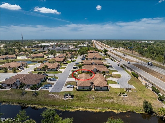 13100 S Mccall Rd Unit 112, Port Charlotte, FL 33981 - aerial perspective of suburban area featuring a major roadway and a large body of water