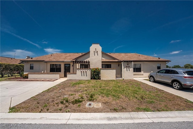 13100 S Mccall Rd Unit 112, Port Charlotte, FL 33981 - single story home featuring stucco siding and a chimney