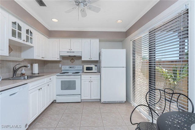 13100 S Mccall Rd Unit 112, Port Charlotte, FL 33981 - kitchen with white appliances, under cabinet range hood, ceiling fan, crown molding, and light countertops