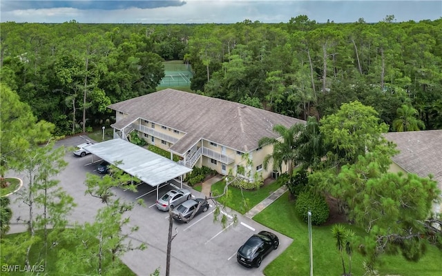 3451 County Barn Rd Unit G103, Naples, FL 34112 - view from above of property with a heavily wooded area