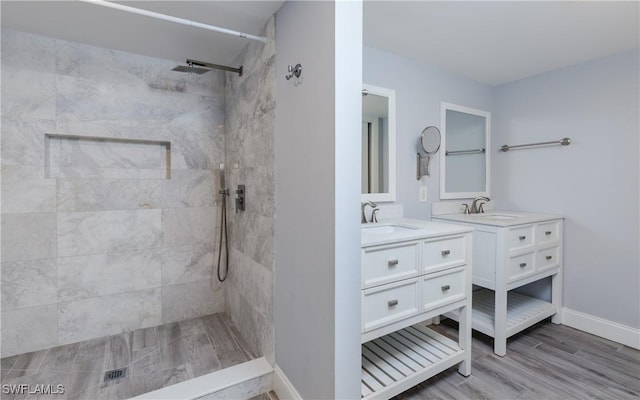 3451 County Barn Rd Unit G103, Naples, FL 34112 - full bath featuring tiled shower, vanity, and wood finished floors