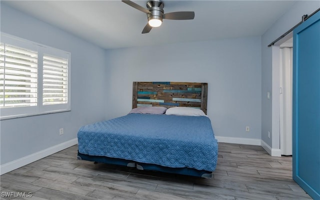 3451 County Barn Rd Unit G103, Naples, FL 34112 - bedroom with wood finished floors and a ceiling fan