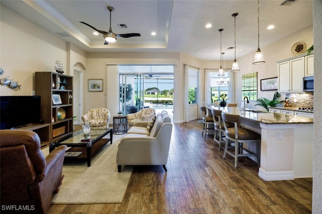 2977 Willow Ridge Ct, Fort Myers, FL 33905 - living room featuring ceiling fan, plenty of natural light, dark wood finished floors, a tray ceiling, and recessed lighting