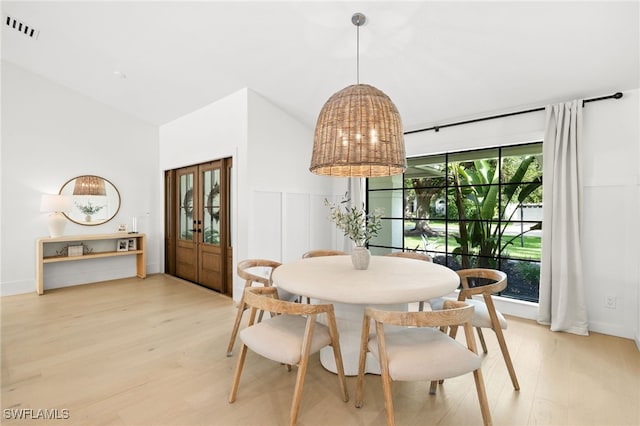 7658 Ponte Verde Way, Naples, FL 34109 - dining room featuring light wood-style floors and high vaulted ceiling