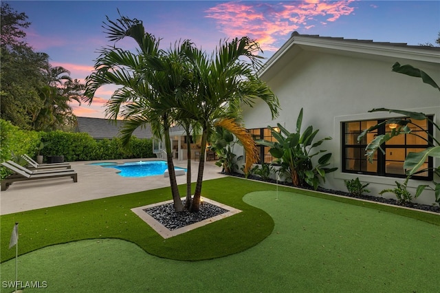 7658 Ponte Verde Way, Naples, FL 34109 - view of yard with a putting green, a patio area, and an outdoor pool