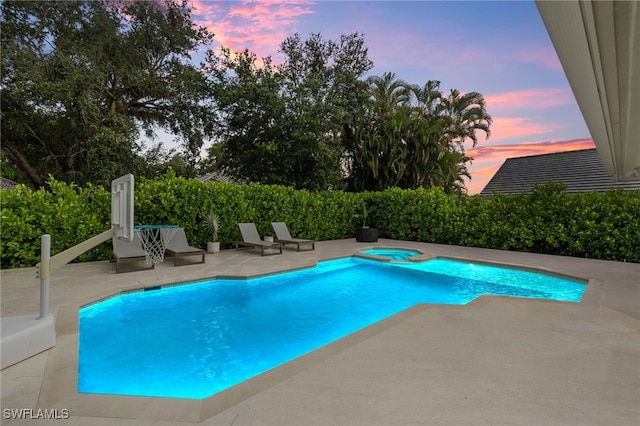 7658 Ponte Verde Way, Naples, FL 34109 - pool at dusk with a patio and a pool with connected hot tub
