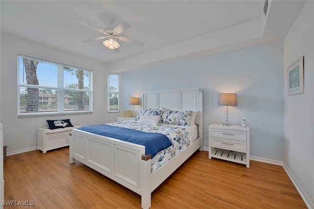 3993 Bishopwood Ct E Unit 101, Naples, FL 34114 - bedroom featuring light wood finished floors and ceiling fan