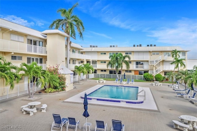 1100 8th Ave S Unit 211B, Naples, FL 34102 - community pool featuring a patio area