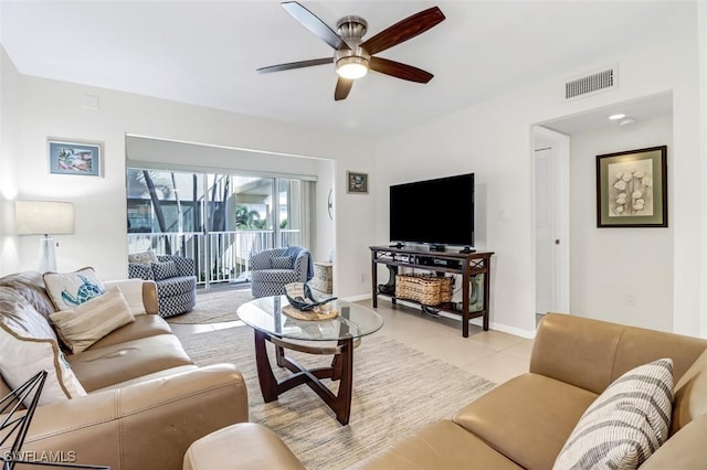 1100 8th Ave S Unit 211B, Naples, FL 34102 - living room featuring ceiling fan and light tile patterned floors