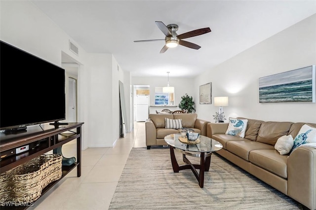 1100 8th Ave S Unit 211B, Naples, FL 34102 - living area featuring ceiling fan and light tile patterned floors