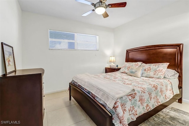 1100 8th Ave S Unit 211B, Naples, FL 34102 - bedroom with a ceiling fan and tile patterned floors