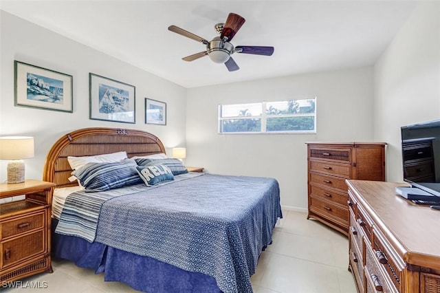 1100 8th Ave S Unit 211B, Naples, FL 34102 - bedroom with light tile patterned floors and ceiling fan