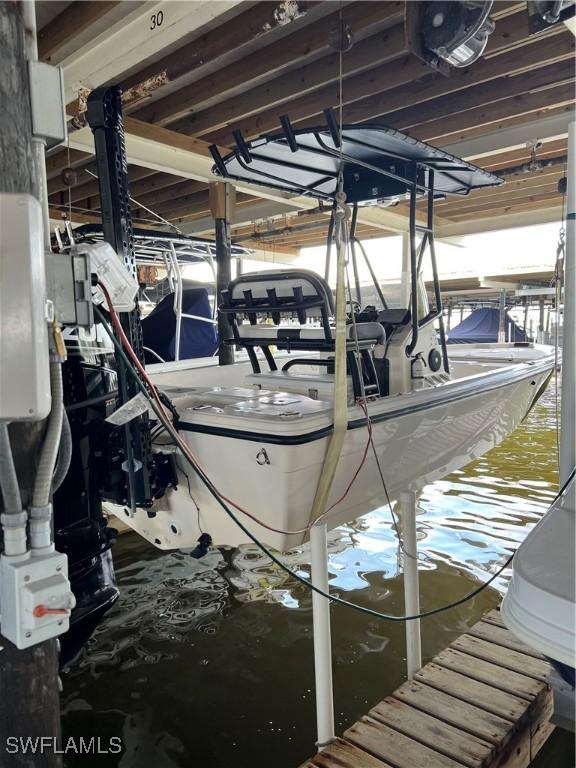 1100 8th Ave S Unit 211B, Naples, FL 34102 - dock featuring boat lift