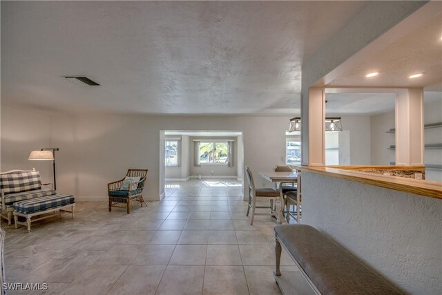 5549 Westwind Ln, Fort Myers, FL 33919 - corridor featuring light tile patterned floors and recessed lighting