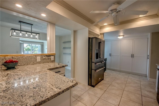 5549 Westwind Ln, Fort Myers, FL 33919 - kitchen with high end fridge, a ceiling fan, crown molding, light tile patterned floors, and light stone counters