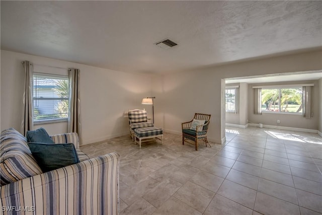 5549 Westwind Ln, Fort Myers, FL 33919 - living area with plenty of natural light and light tile patterned floors