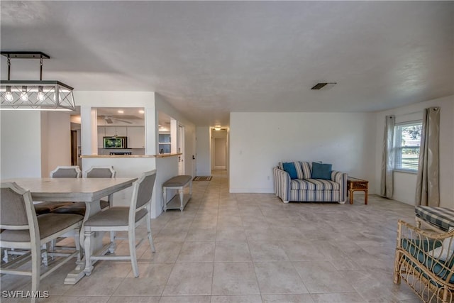 5549 Westwind Ln, Fort Myers, FL 33919 - dining room with light tile patterned floors and ceiling fan