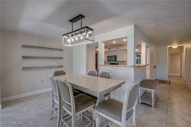 5549 Westwind Ln, Fort Myers, FL 33919 - dining area with light tile patterned flooring and ceiling fan