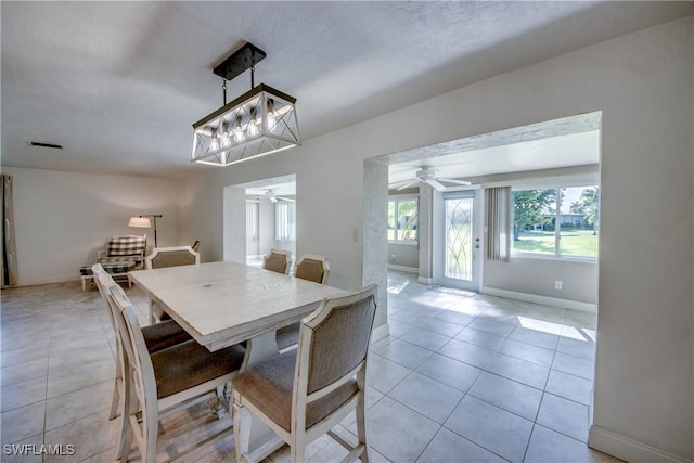 5549 Westwind Ln, Fort Myers, FL 33919 - dining room with a ceiling fan and light tile patterned floors