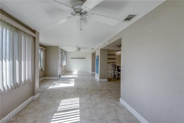 5549 Westwind Ln, Fort Myers, FL 33919 - corridor with baseboards and light tile patterned floors