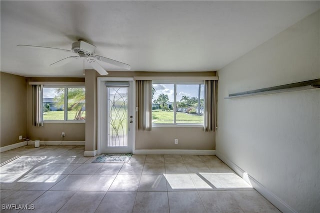 5549 Westwind Ln, Fort Myers, FL 33919 - tiled empty room featuring healthy amount of natural light and ceiling fan